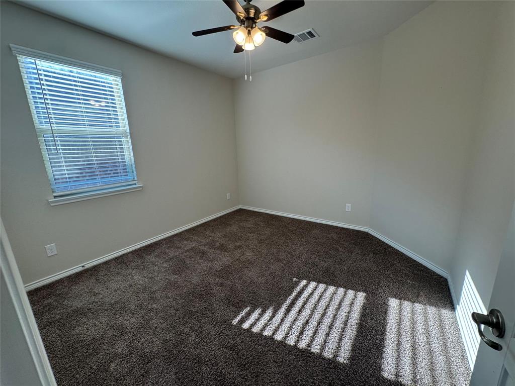 940 Azure Lane Celina, TX 75009 - Photo 10 of 26 an empty room with windows