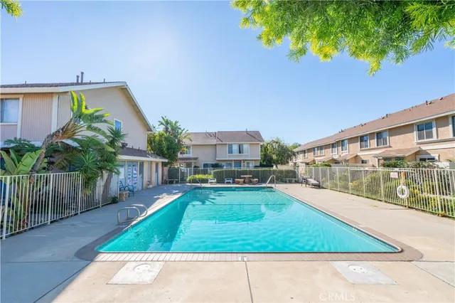 a view of a swimming pool with a patio