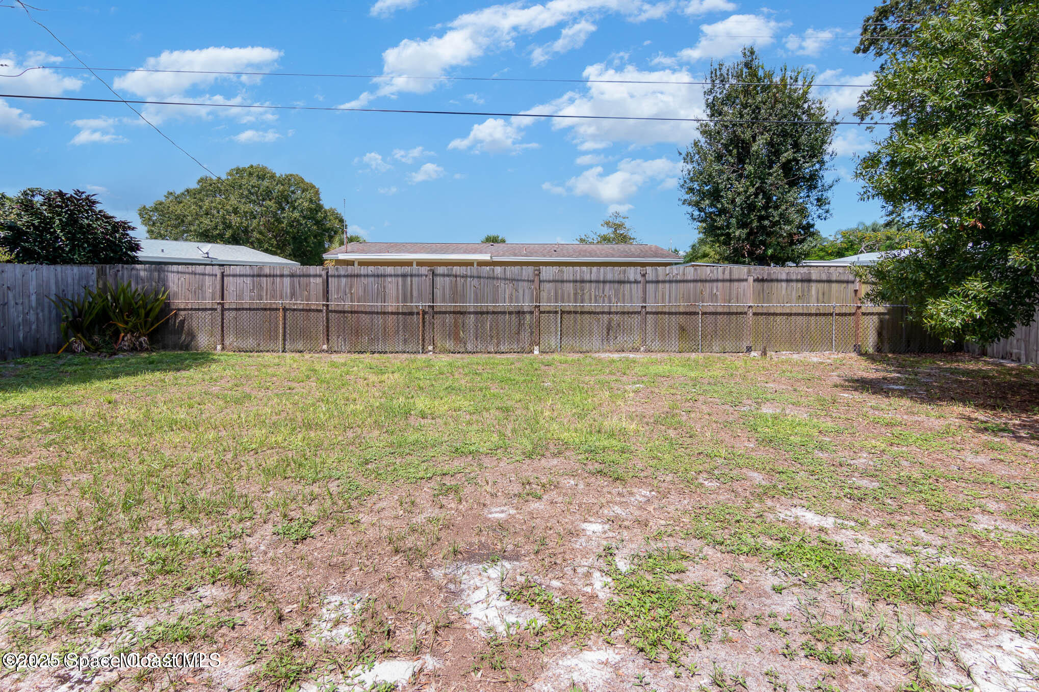2360 Apache Drive Melbourne, FL 32935 - Photo 12 of 13 a view of a backyard with a small cabin