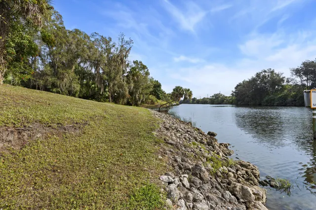 a view of lake with green space
