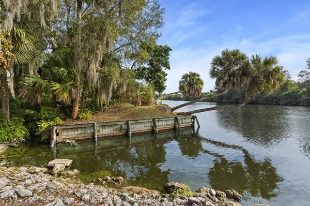 a view of a lake with a house in the background