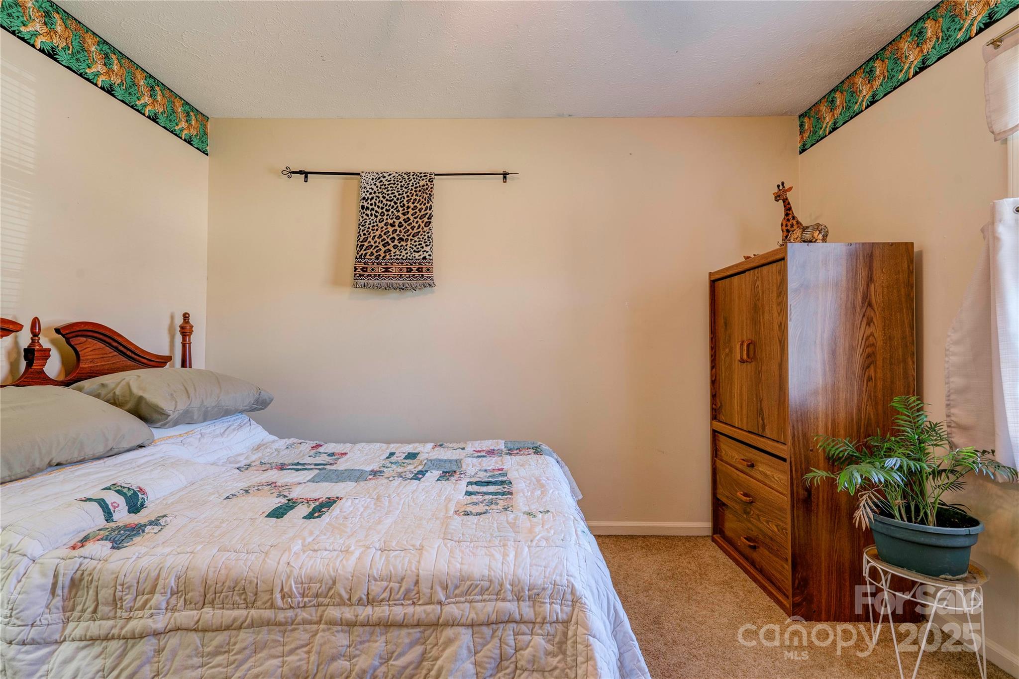914 Parkwood Road Shelby, NC 28150 - Photo 14 of 40 a bedroom with a bed and a mirror