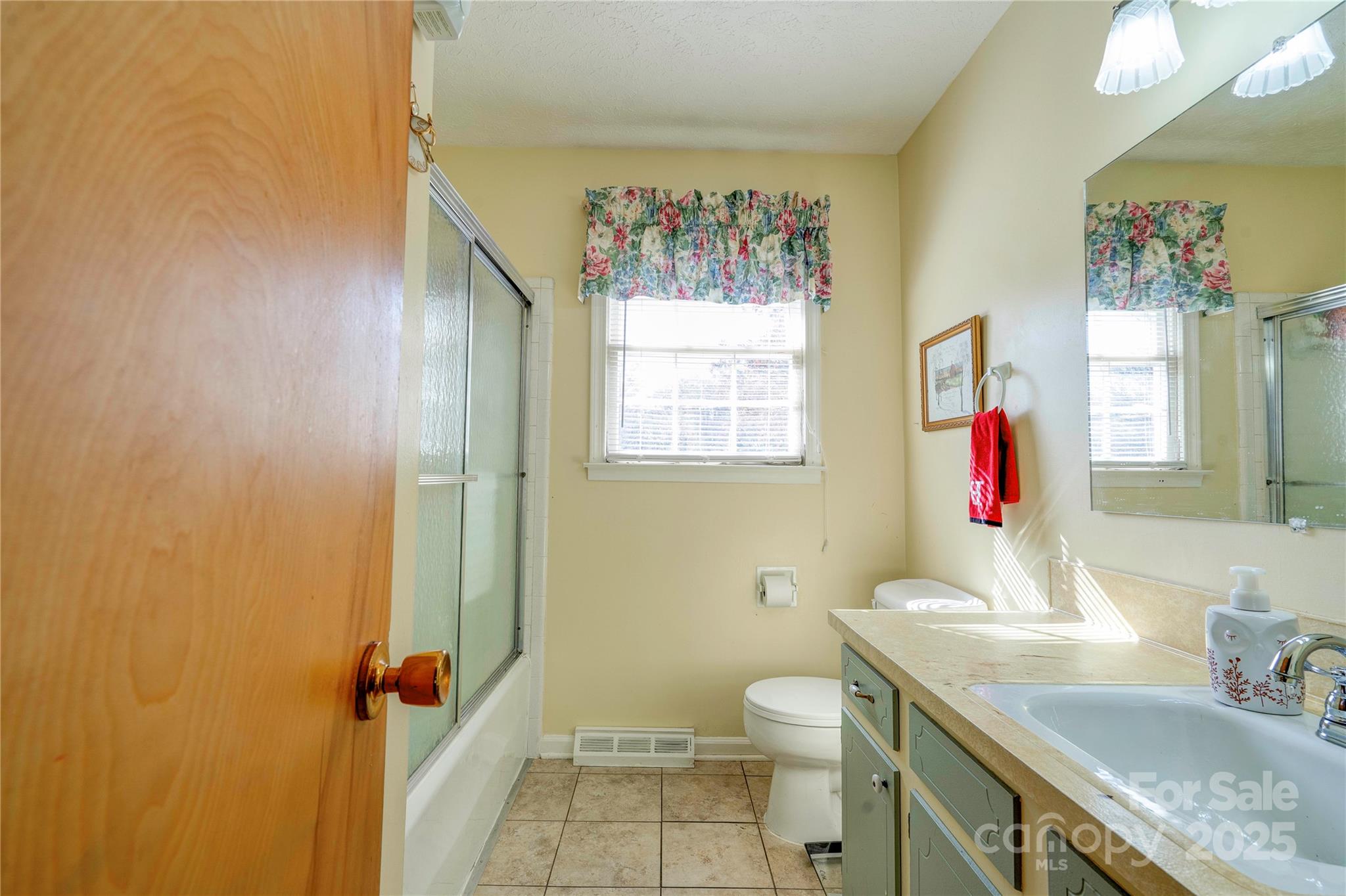 914 Parkwood Road Shelby, NC 28150 - Photo 20 of 40 a bathroom with a sink vanity mirror and toilet