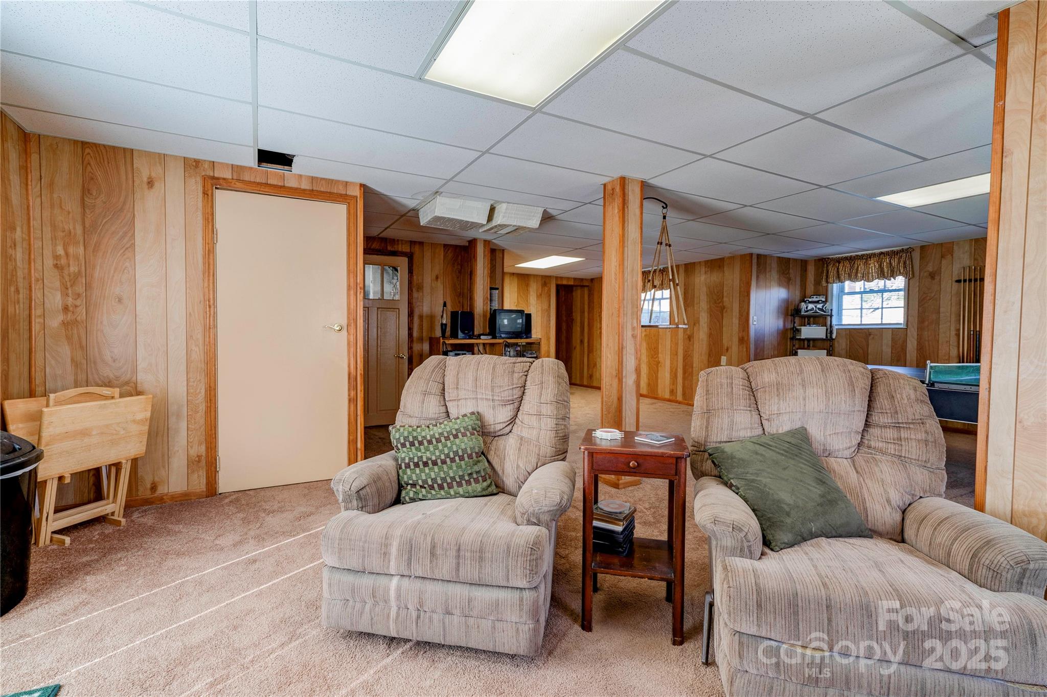 914 Parkwood Road Shelby, NC 28150 - Photo 24 of 40 a living room with furniture and a chandelier