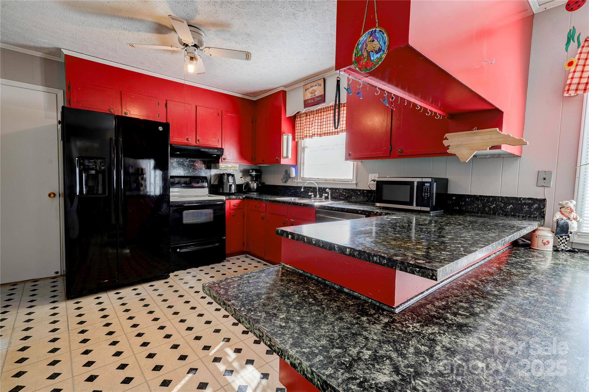 914 Parkwood Road Shelby, NC 28150 - Photo 8 of 40 a kitchen with stainless steel appliances granite countertop a stove a sink and a refrigerator