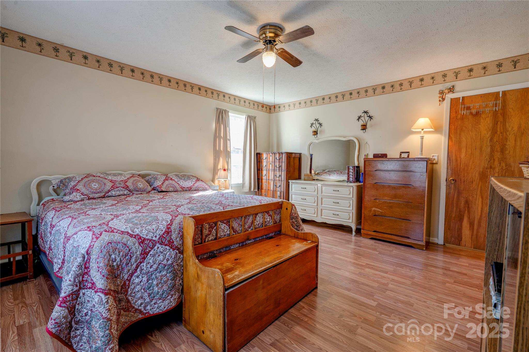 914 Parkwood Road Shelby, NC 28150 - Photo 10 of 40 a bedroom with a bed and wooden floor