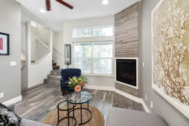 a living room with furniture and a potted plant
