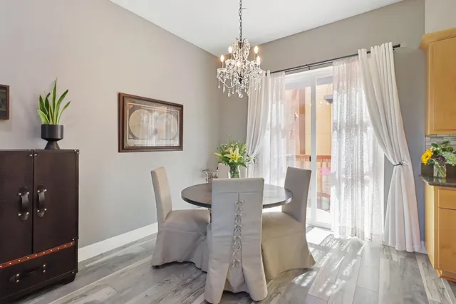a kitchen with a table and chairs