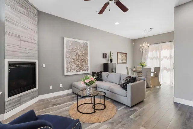 a living room with furniture and a fireplace