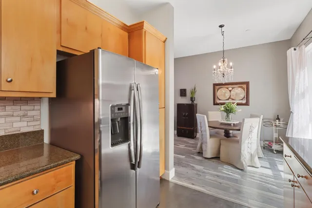 a kitchen with granite countertop a sink and a window