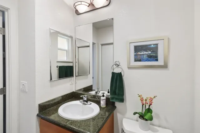 a view of washer and dryer with kitchen in the background