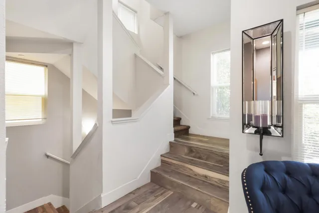 a bathroom with a double vanity sink mirror and toilet
