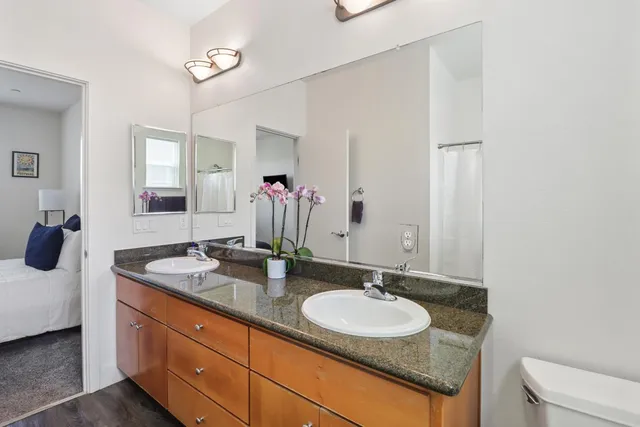 a dining room with furniture and a window