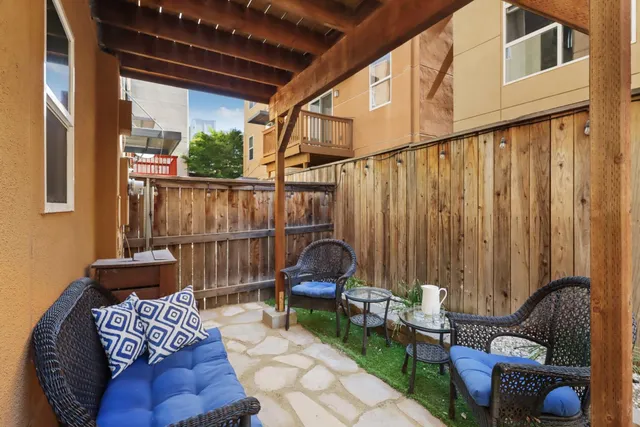 a view of balcony with furniture