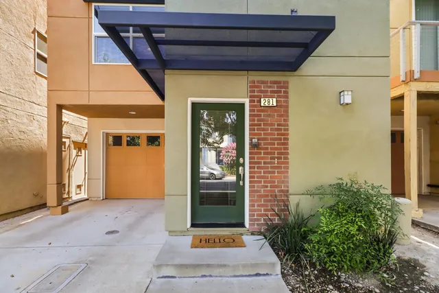 a view of a hallway with a wooden floor