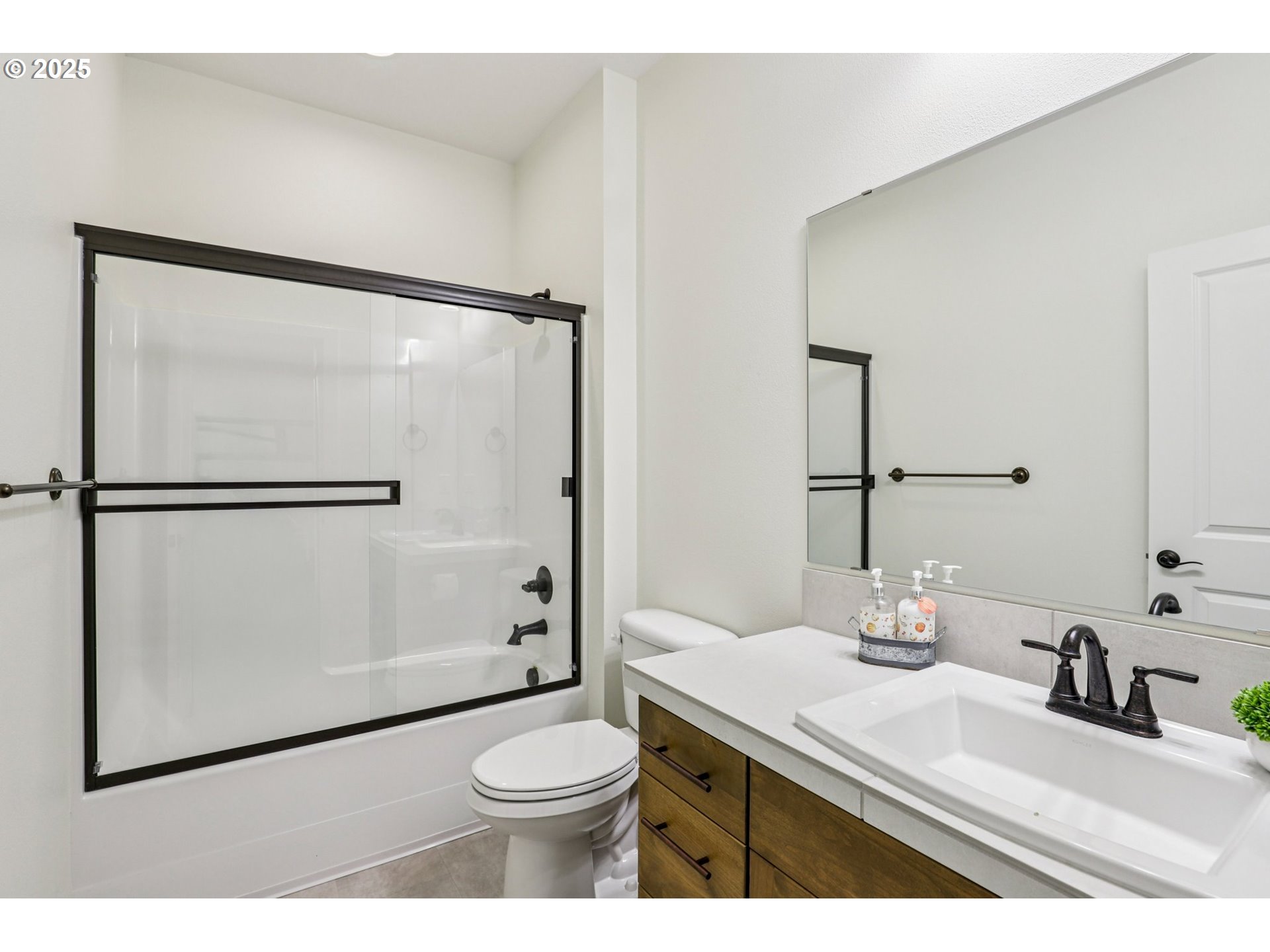 714 Southeast 37th Street Battle Ground, WA 98604 - Photo 11 of 21 a bathroom with a sink a toilet and shower