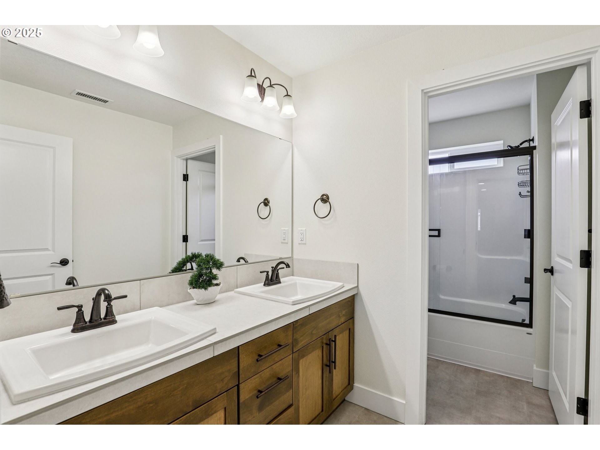 714 Southeast 37th Street Battle Ground, WA 98604 - Photo 14 of 21 a bathroom with a sink vanity granite tub and a mirror