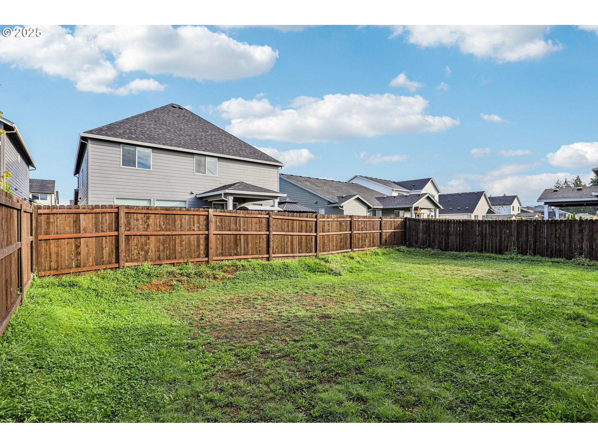 714 Southeast 37th Street Battle Ground, WA 98604 - Photo 20 of 21 a view of a backyard with table and chairs