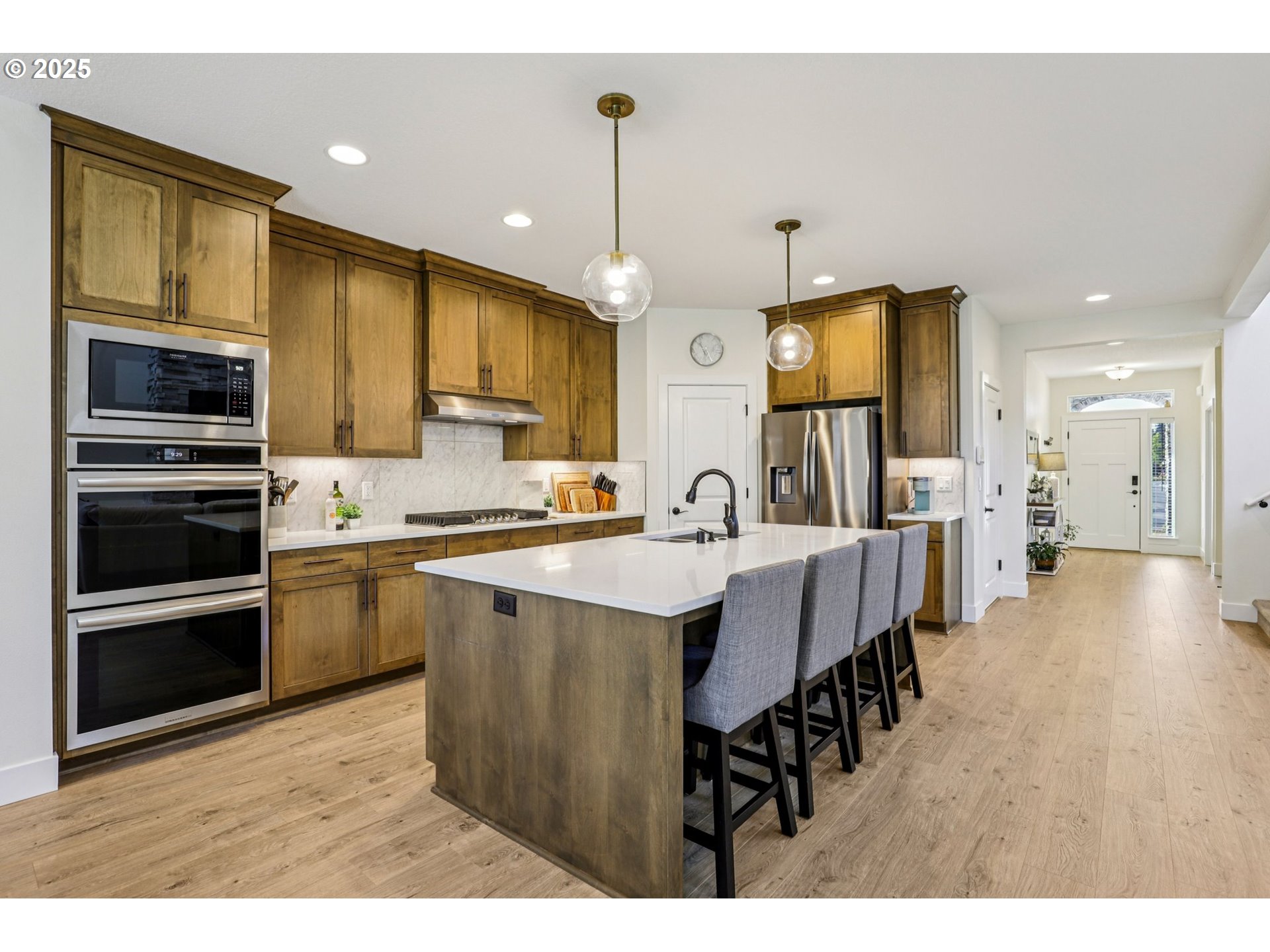 714 Southeast 37th Street Battle Ground, WA 98604 - Photo 7 of 21 a kitchen with stainless steel appliances kitchen island granite countertop a sink and cabinets
