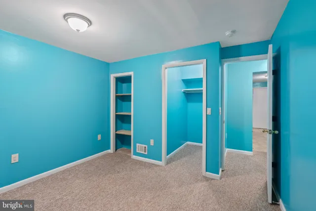 an empty room with closet and closet