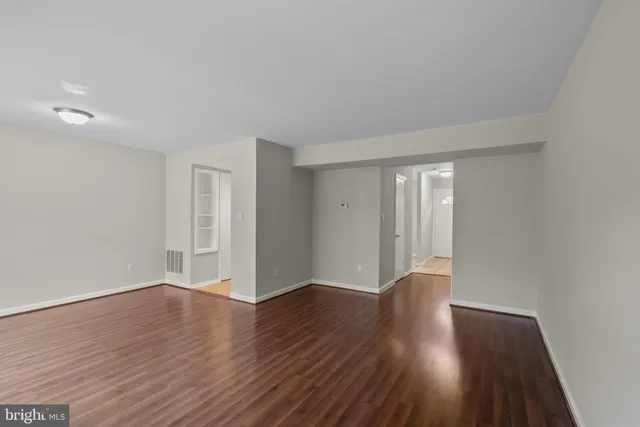 a view of a livingroom with a ceiling fan and a large window