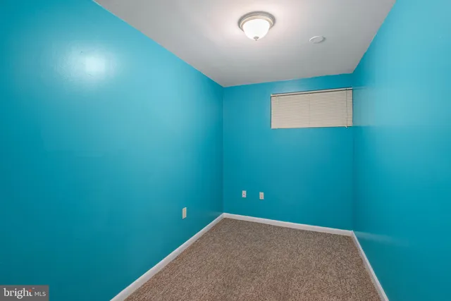 a view of a hallway with wooden shelves