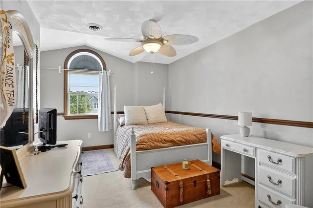 a bed room with a bed and a chandelier