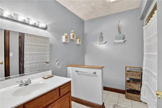 a bathroom with a sink a vanity and a mirror