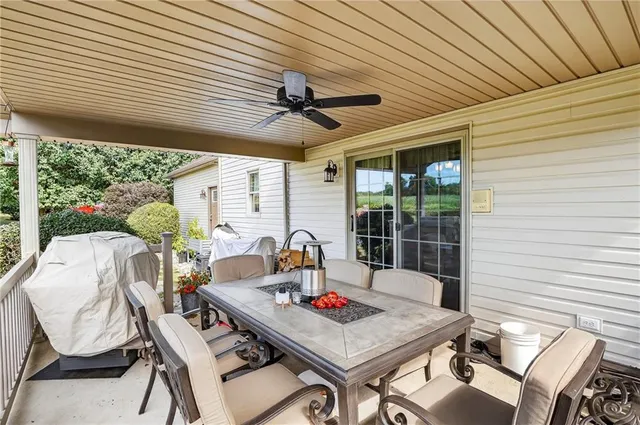 a view of a patio with a table chairs and a table