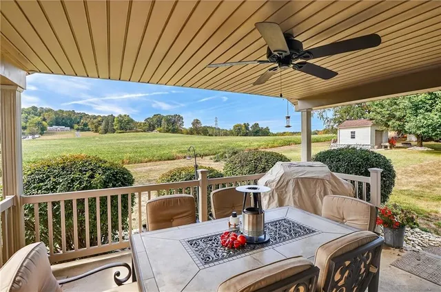 a front view of house with yard and trees around