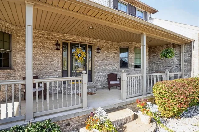 a view of a patio with a table and chairs