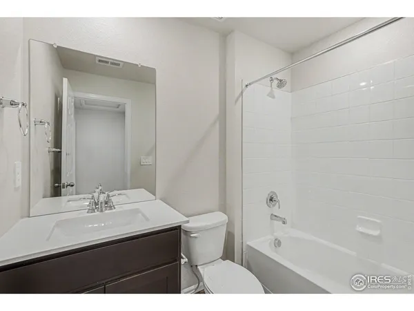 a bathroom with a sink a toilet and a bathtub