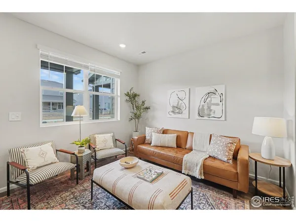 a living room with furniture and a table