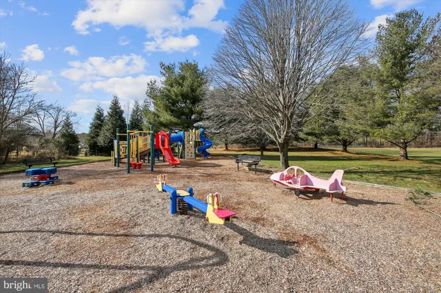 a view of swimming pool with an outdoor space and seating area