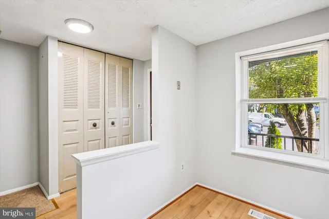 a kitchen with stainless steel appliances a stove a refrigerator and a window