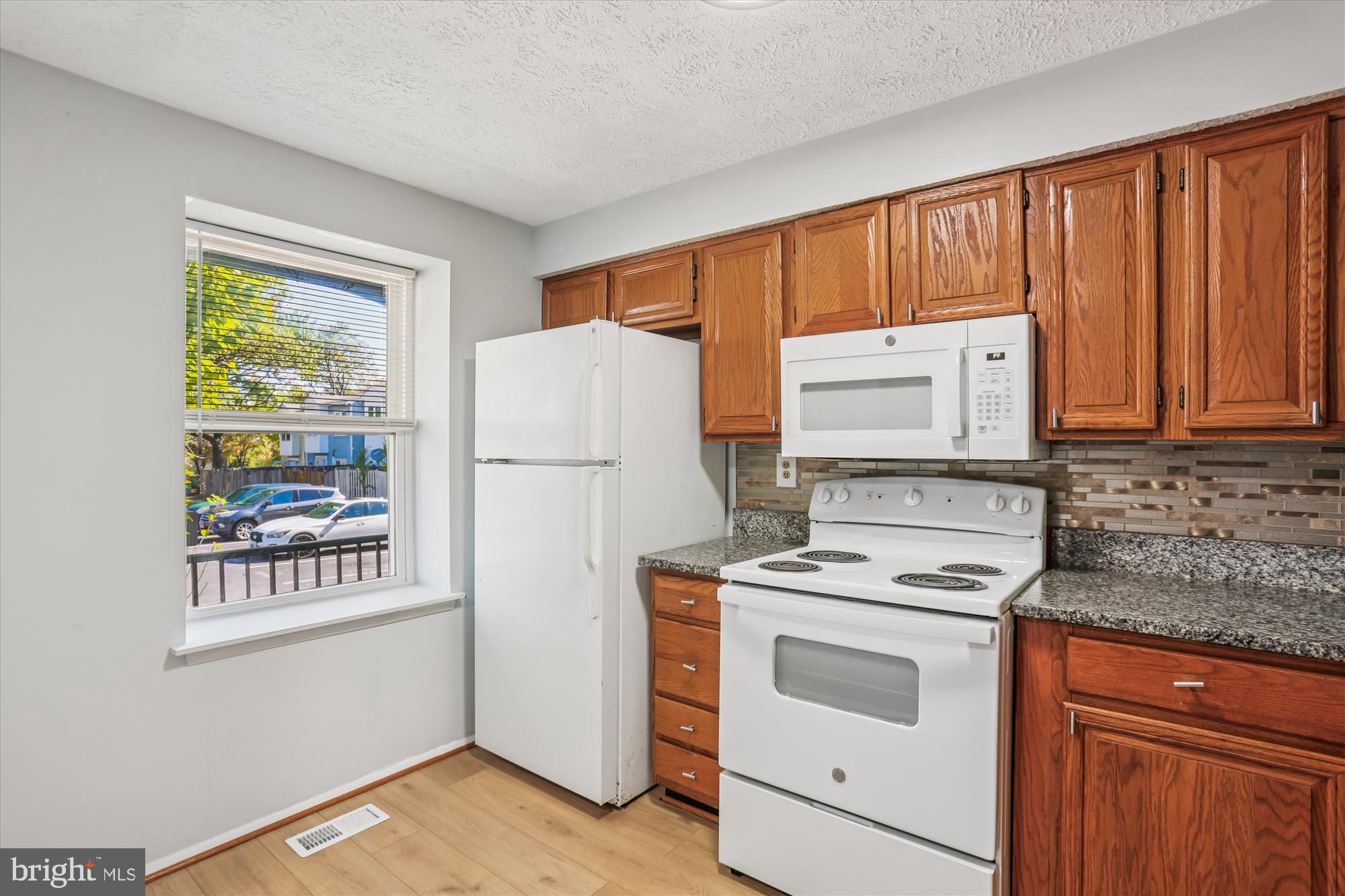 2839 Shepperton Terrace Silver Spring, MD 20904 - Photo 10 of 48 a kitchen with stainless steel appliances a stove a refrigerator and a window