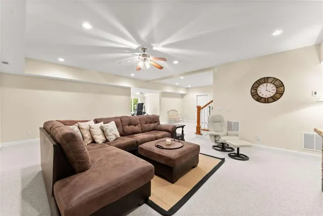 a bedroom with a bed and a ceiling fan