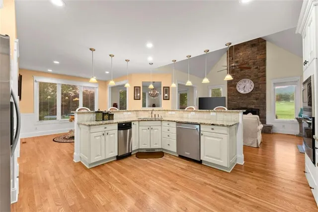 a large white kitchen with lots of counter space