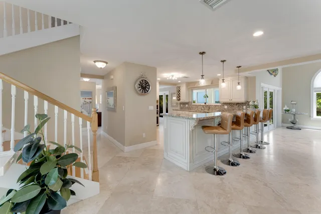 a kitchen with stainless steel appliances granite countertop a stove sink and cabinets