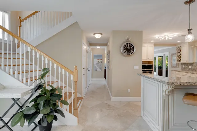 a kitchen with stainless steel appliances a refrigerator sink and cabinets