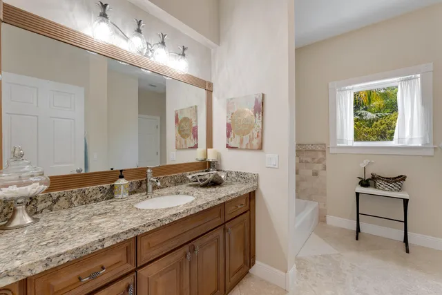 a dining room with furniture and a floor to ceiling window