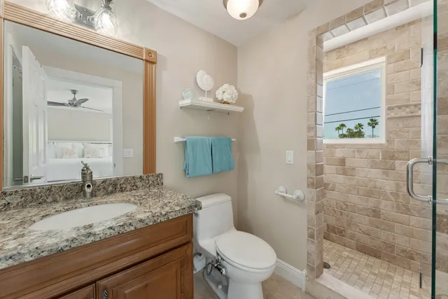 a spacious bedroom with a bed and a couch