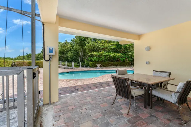an aerial view of a city with lots of residential buildings lake and ocean view