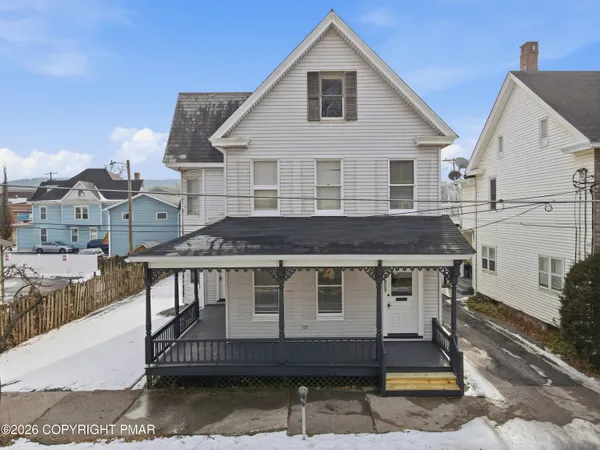 a aerial view of a house with a balcony