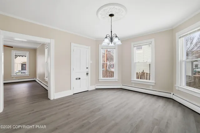 a kitchen with stainless steel appliances granite countertop a refrigerator stove microwave and sink