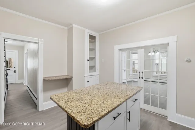 a view of a storage & utility room with a window