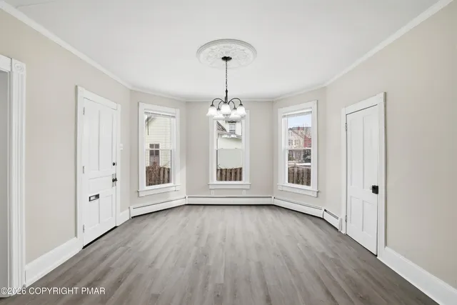 a view of a hallway view with staircase