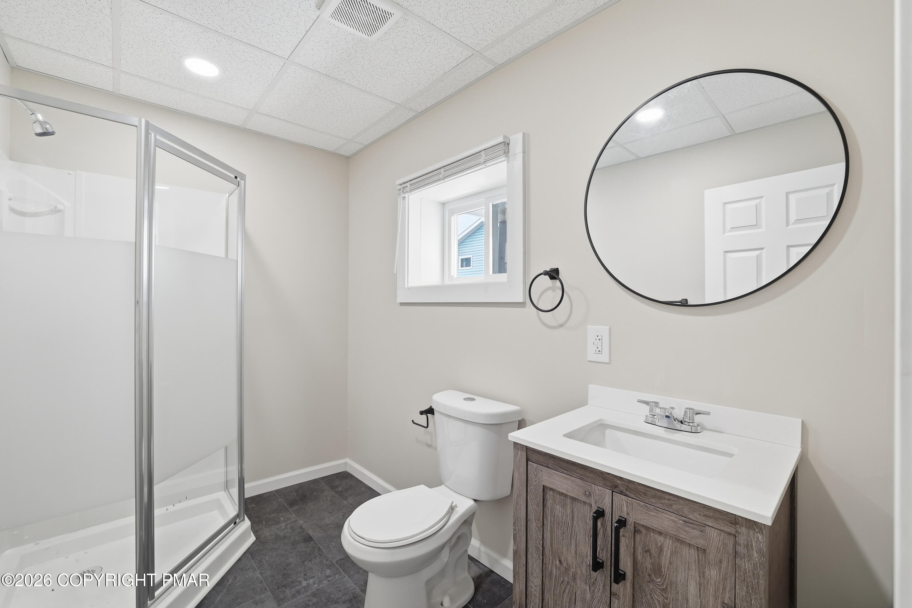 809 Monroe Street Stroudsburg, PA 18360 - Photo 22 of 55 a bathroom with a toilet a sink and mirror
