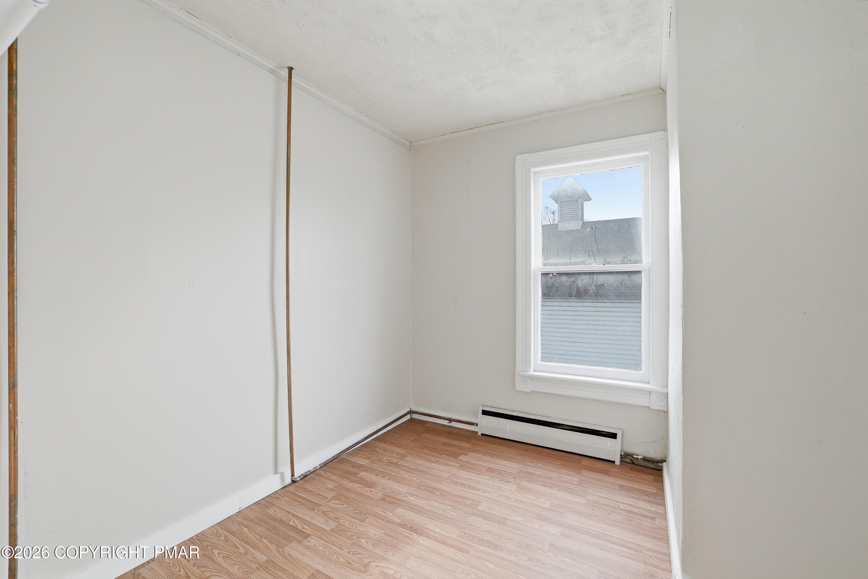 809 Monroe Street Stroudsburg, PA 18360 - Photo 32 of 55 a view of empty room with wooden floor and fan
