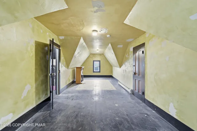an aerial view of a residential houses with street